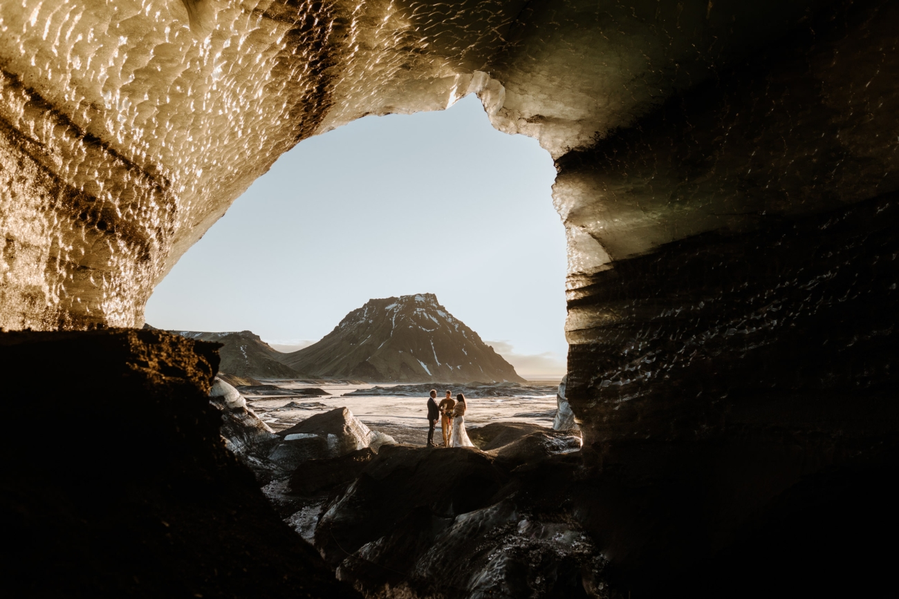 A sunrise elopement ceremony in an ice cave in Iceland.