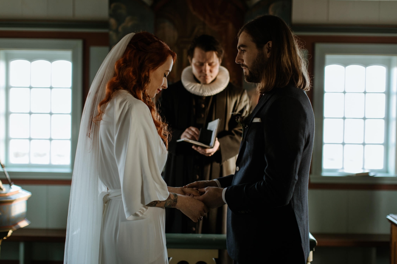 A wedding ceremony inside the black church at Budir, west Iceland.