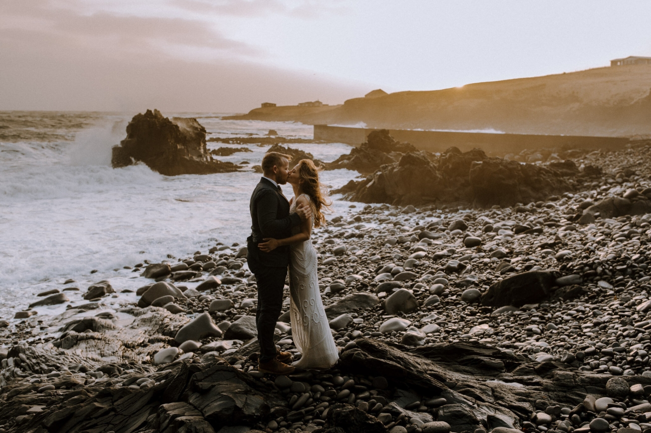 A wedding by the stormy seas of the Atlantic in the winter sun.