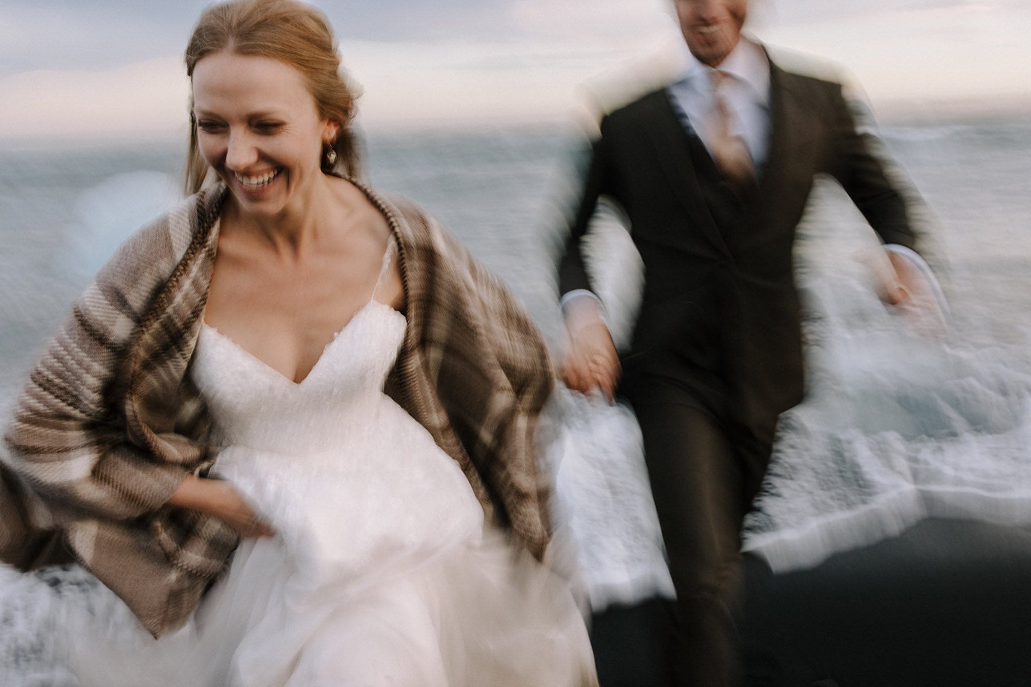 Running from the waves at the Diamond Beach
