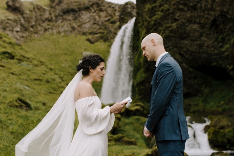 A couple gets married in front of a hidden waterfall.
