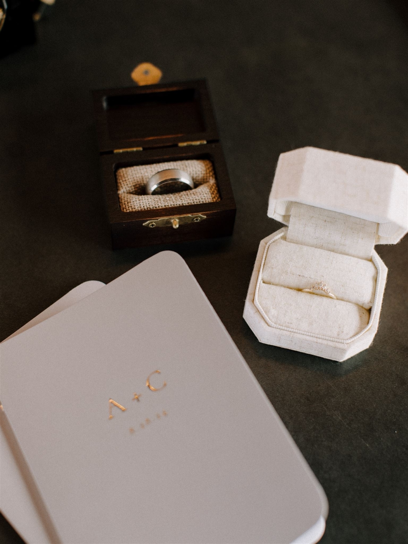 Elopement details. Wedding rings and personal vow books.