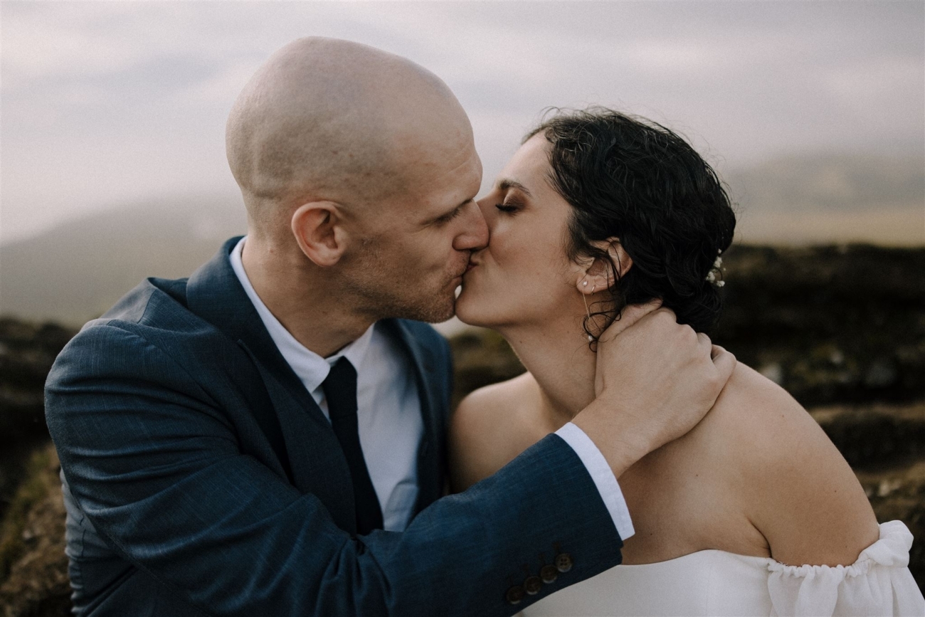 A bride and groom kissing on their elopement day in Iceland.
