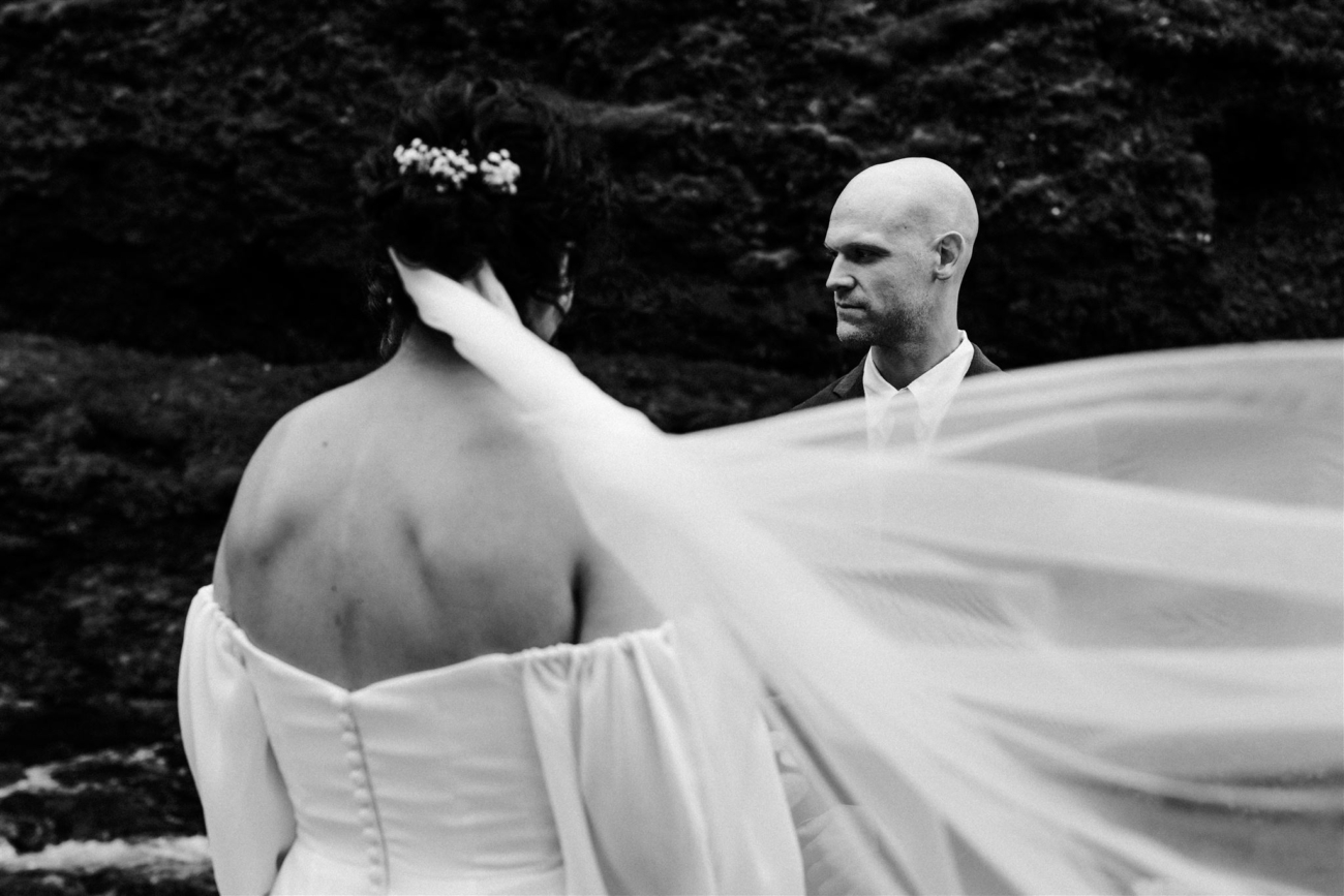 A breeze blowing through a white veil during an Iceland elopement ceremony.