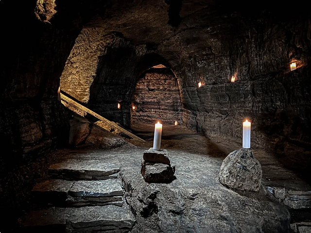 A candle lit cave in the town of Hella.