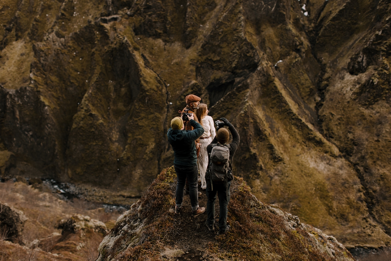 A photographer and videographer working together to capture the magic of an elopement in the mountains.