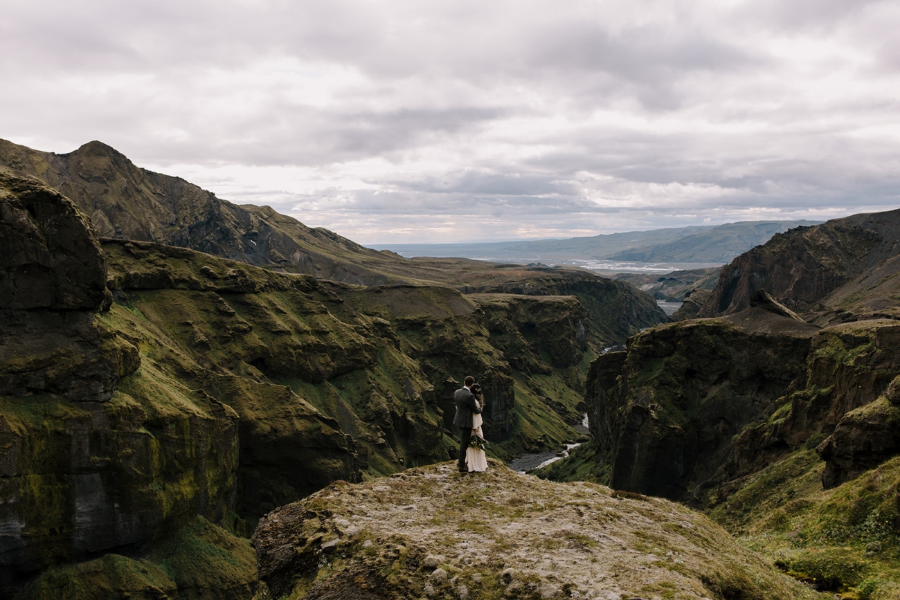 Personal wedding ceremony held at remote Þórsmörk overlook with mountains in background