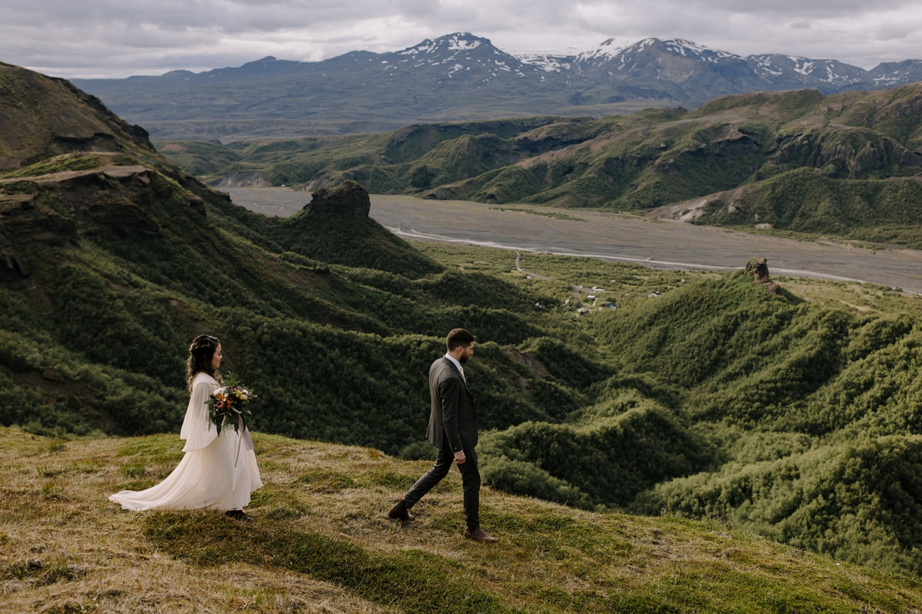A couple hiking in the highlands during their adventure elopement in Iceland.