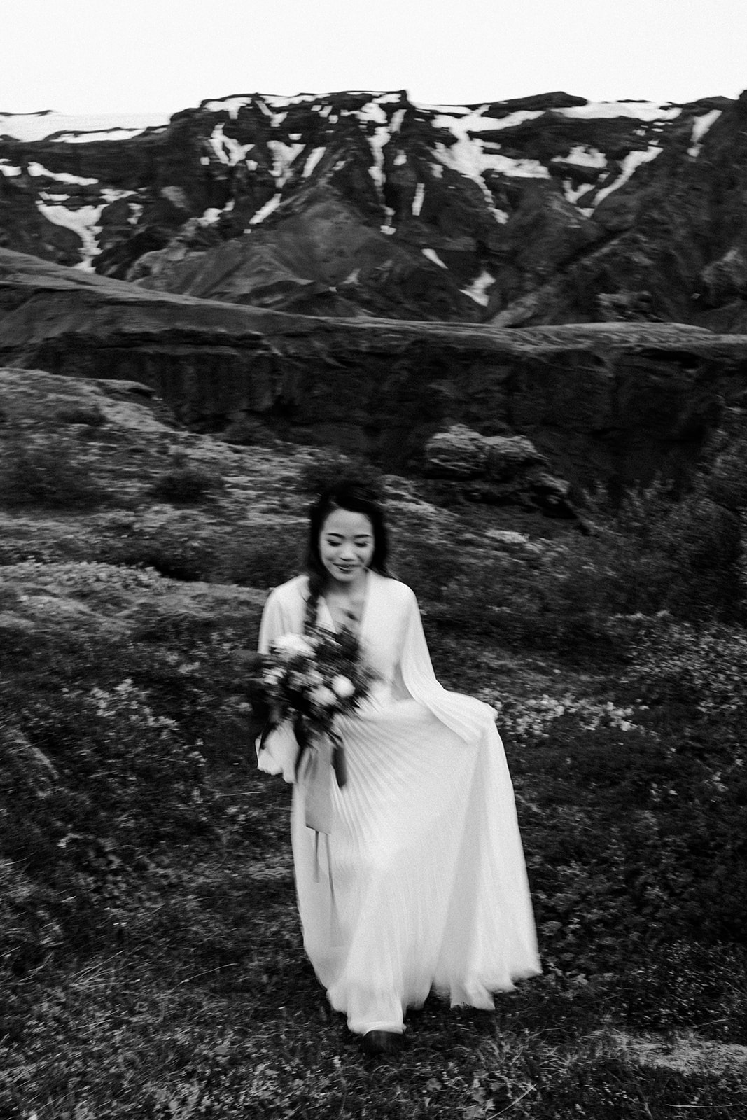 Portrait show casing the beautiful movement of a wedding dress in soft light. 