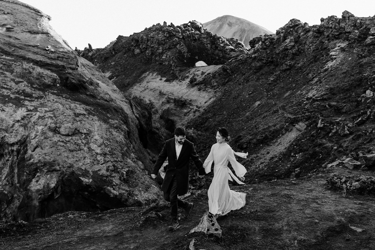 A couple frolics through alien landscapes in Landmannalaugar, Iceland during their highlands elopement. 