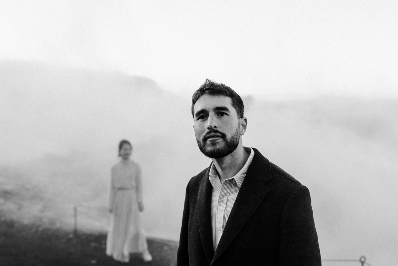 A couple finding their way through steamy lava fields in Iceland.